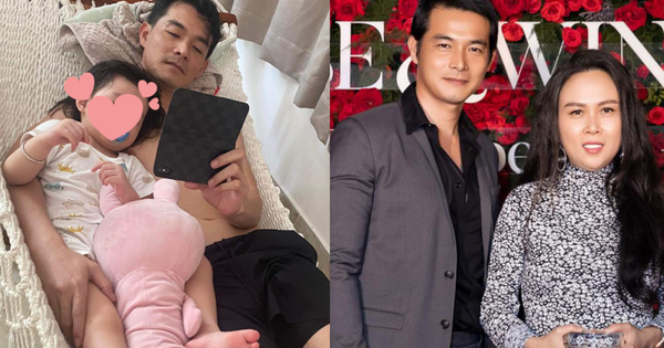 Quach Ngoc Ngoan shows off his 3 year old daughter