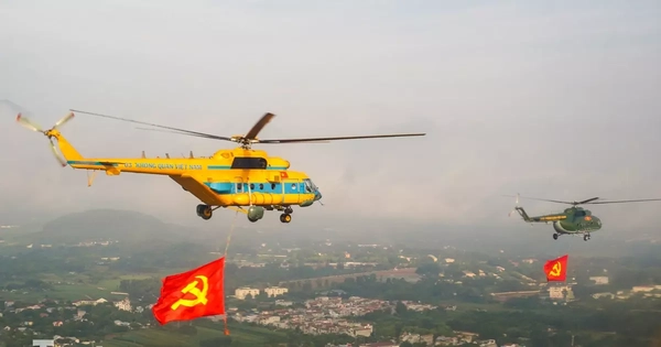 10 trực thăng thao luyện kéo cờ Đảng, cờ Tổ quốc trên bầu trời Hà Nội