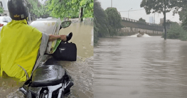 Khung cảnh lạ giữa Hà Nội mênh mông biển nước: Người mang đồ đi bắt cá giữa đường, người lướt ca nô, người đạp vịt trên "vịnh" Văn Quán