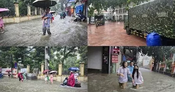 Thủ đô ngập lụt chưa từng có: Quân đội điều xe cứu trợ, phụ huynh bì bõm cõng con tan trường