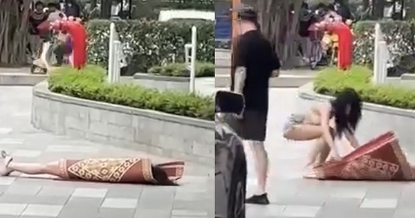 Clip hot girl có hành động khó hiểu, nằm đắp chiếu giữa sảnh chung cư đông người